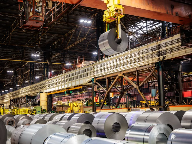 Rolls with steel sheets at the warehouse.