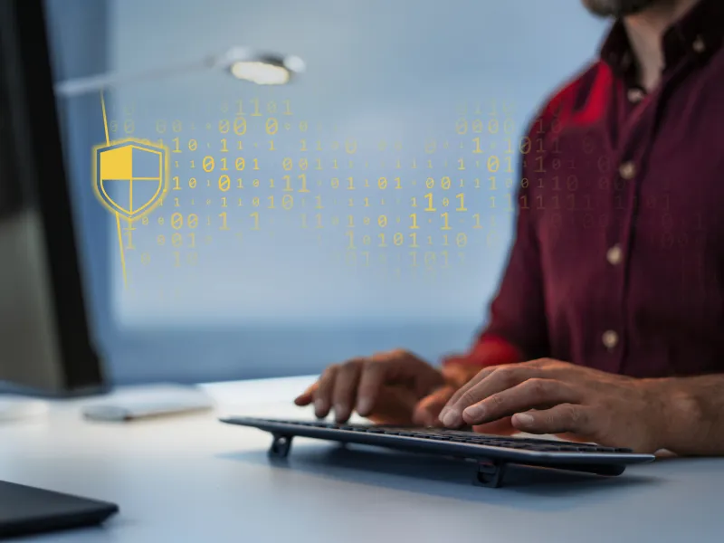 man using computer cybersecurity overlay