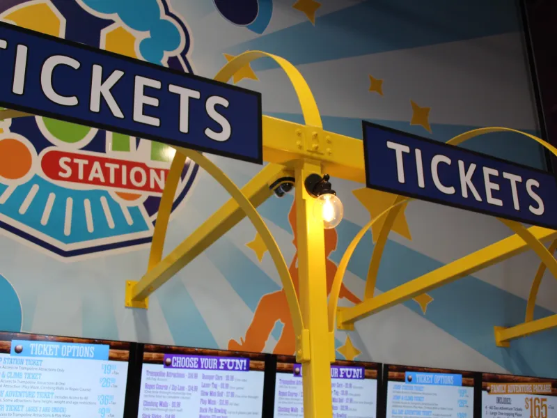 Line for tickets with The Fun Station logo in background