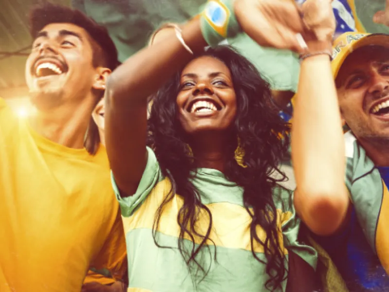 Fans cheering in stadium stands