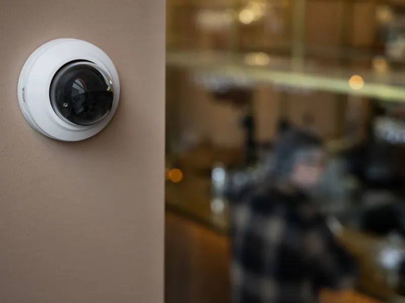 Dome camera mounted on wall in a restaurant 