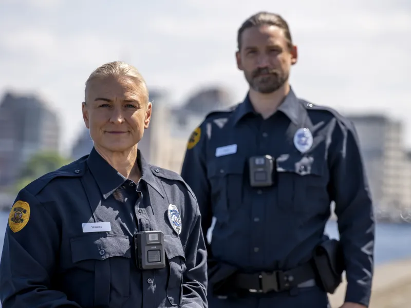 Two police officers wearing AXIS W102 Body Worn Camera