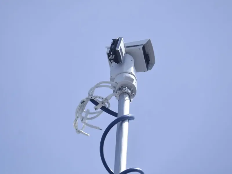 Camera mounted on pole that extends from the mobile unit