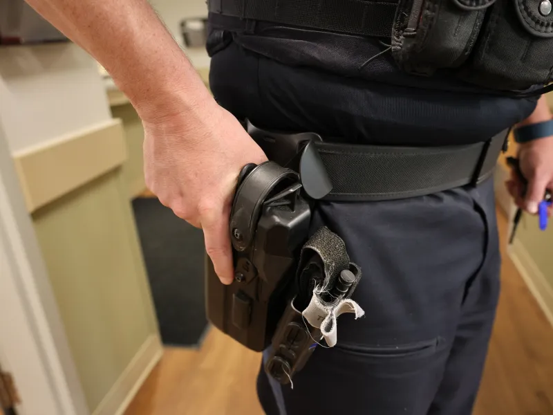 Close up of weapon in patrolman's Yardarm Holster