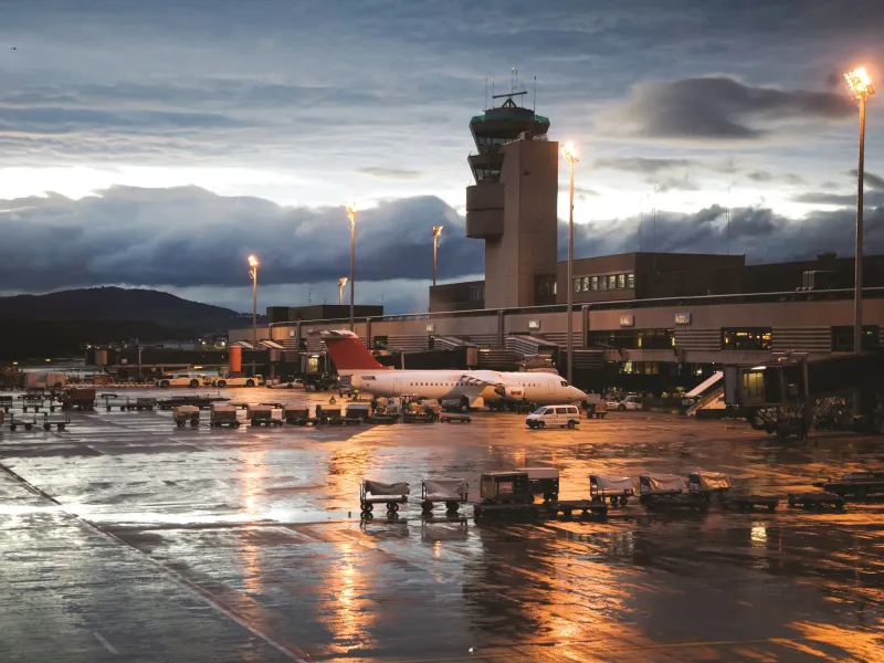 Image of an airport on a raining evening