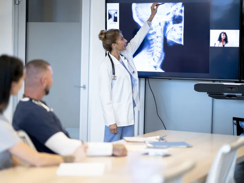 Medical professionals virtual meeting patients scans