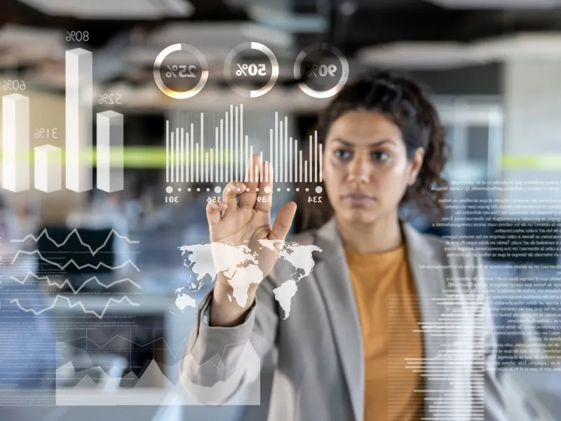 woman views virtual data graphs for data insights