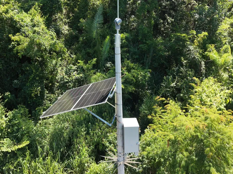 Shot of camera and panel atop a pole on highway