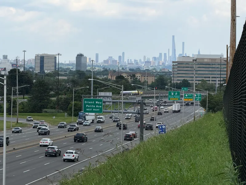 Rt.3 traffic in Rutherford, NJ with cityscape