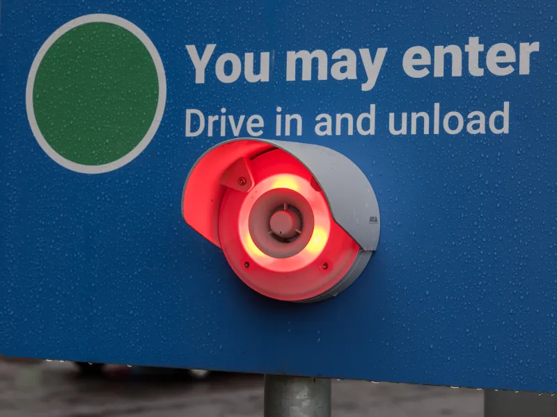 Red light signal on a recycling centre entry device indicating an intervention is needed