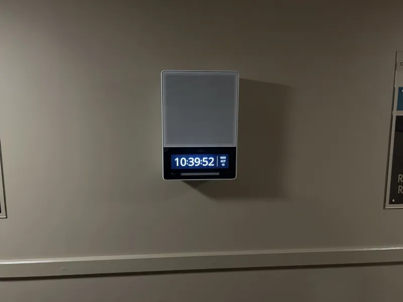 Axis network speaker with display mounted in a Premier Inn hallway
