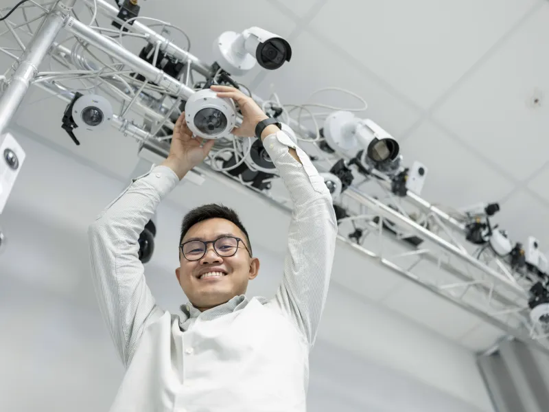 Axis employee, Andy Truong, mounting Axis cameras