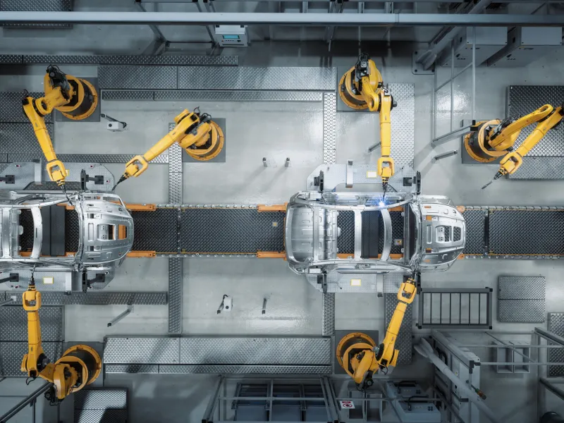 Aerial view of a car factory with robot machines.