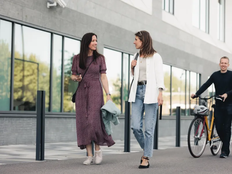 Axis colleagues strolling together at our headquarters in Lund.