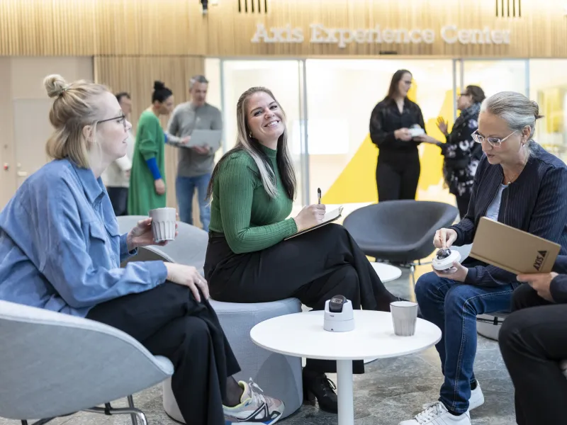 Colleagues at Axis having a casual meeting at the Axis office.