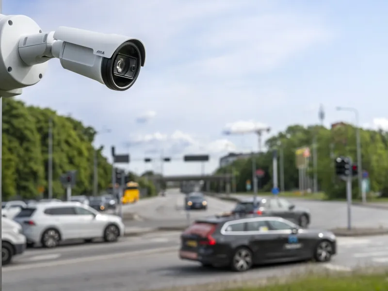Bullet camera mounted on pole infront of traffic 