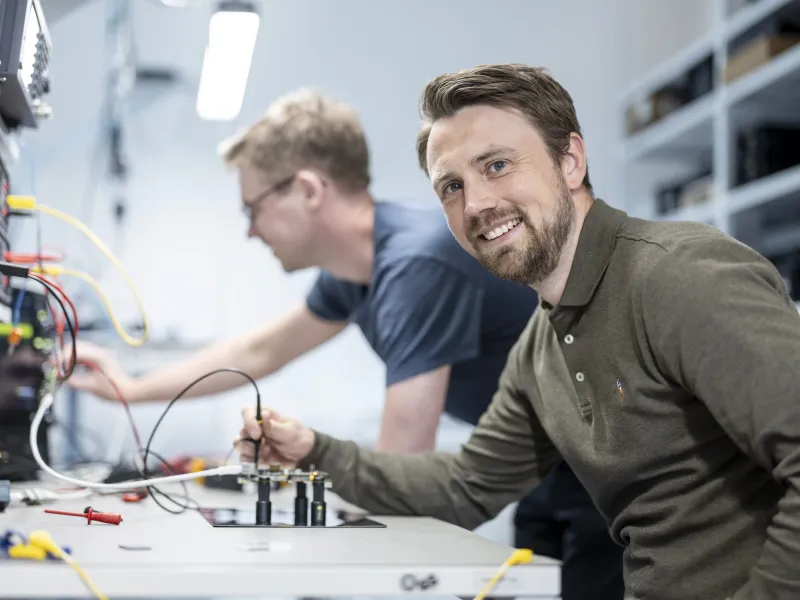 Two Axis colleagues at our Linköping office working on a project together.