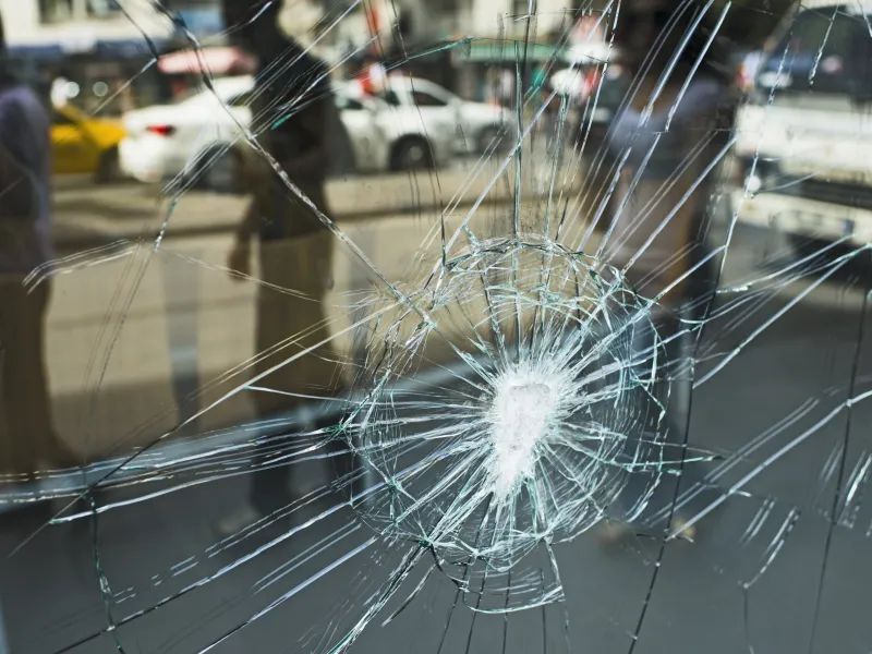 Broken window glass in a city environment 