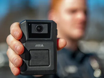 Axis body worn camera held out by officer