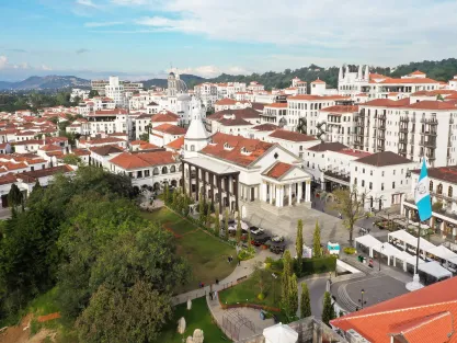 Aerial view of city with flag