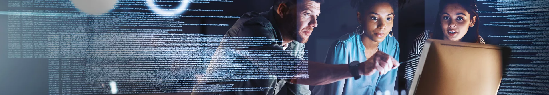 Programmers coding on computer