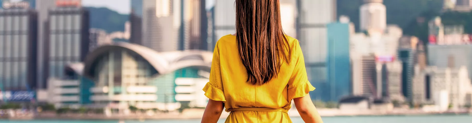 Woman looking out over a city