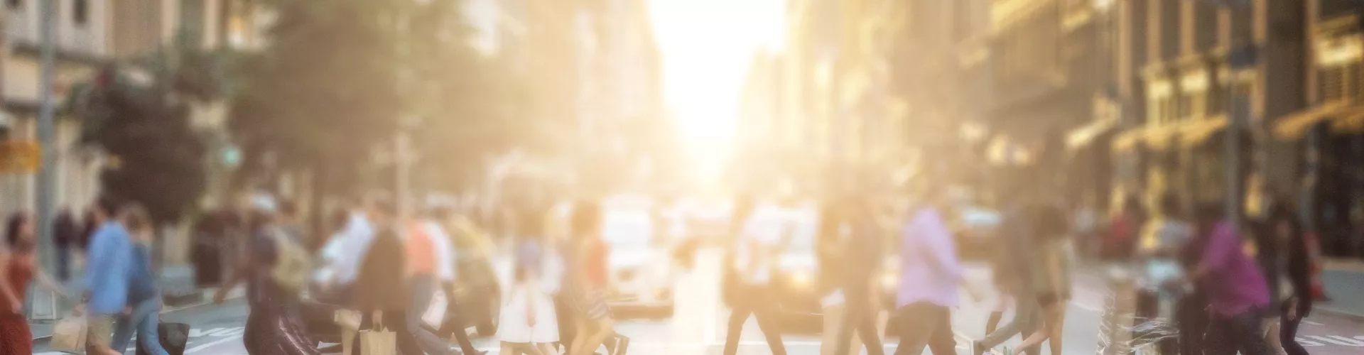 Blurry picture of people crossing crosswalk in a city