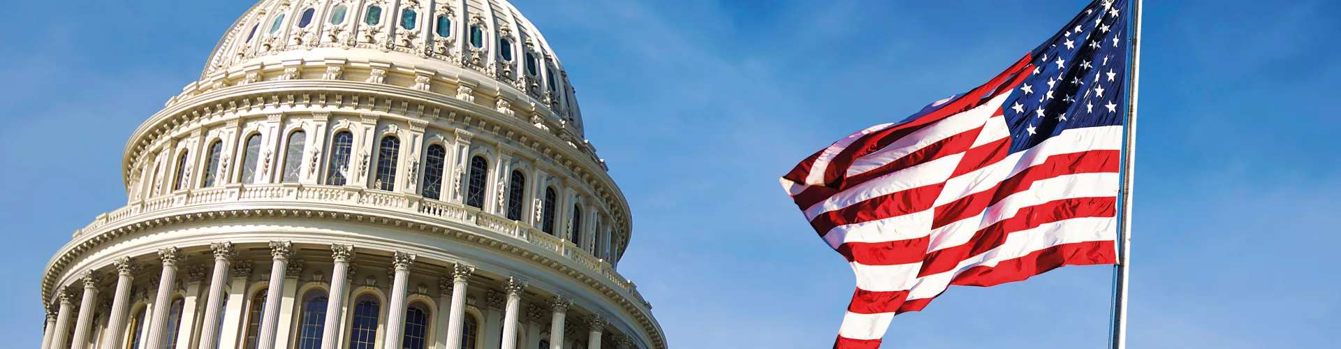 Capitol hill building with american flag