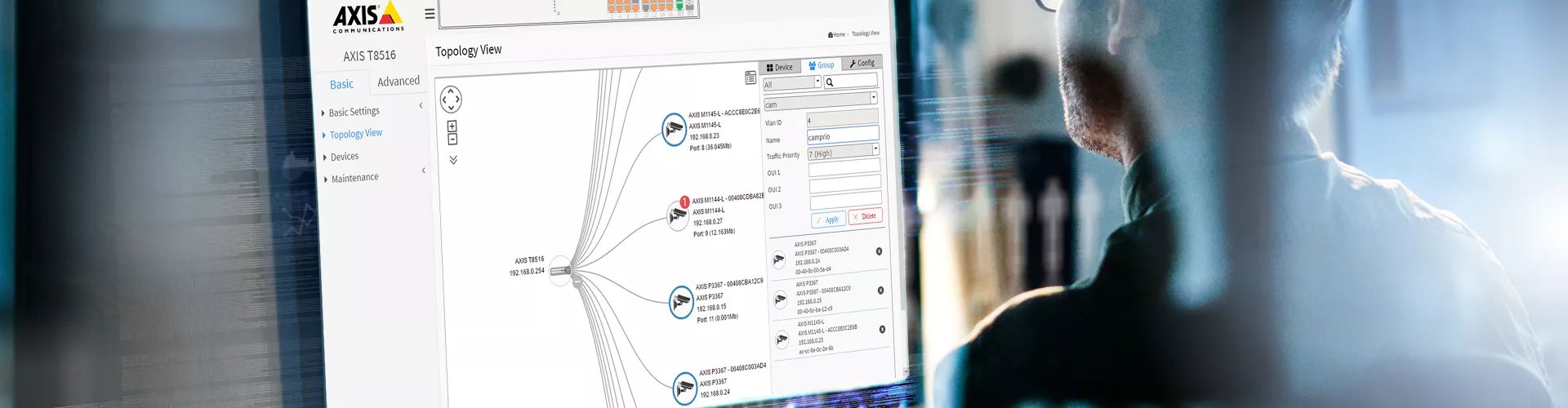 Person sittning by computer screen and programming 
