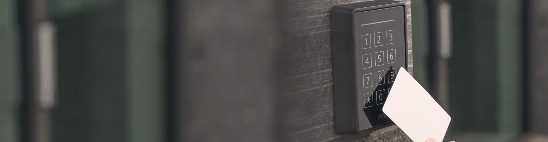 access control, hand holding a card to enter the door