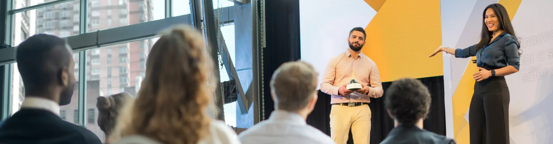 TIP woman and man presenting at event