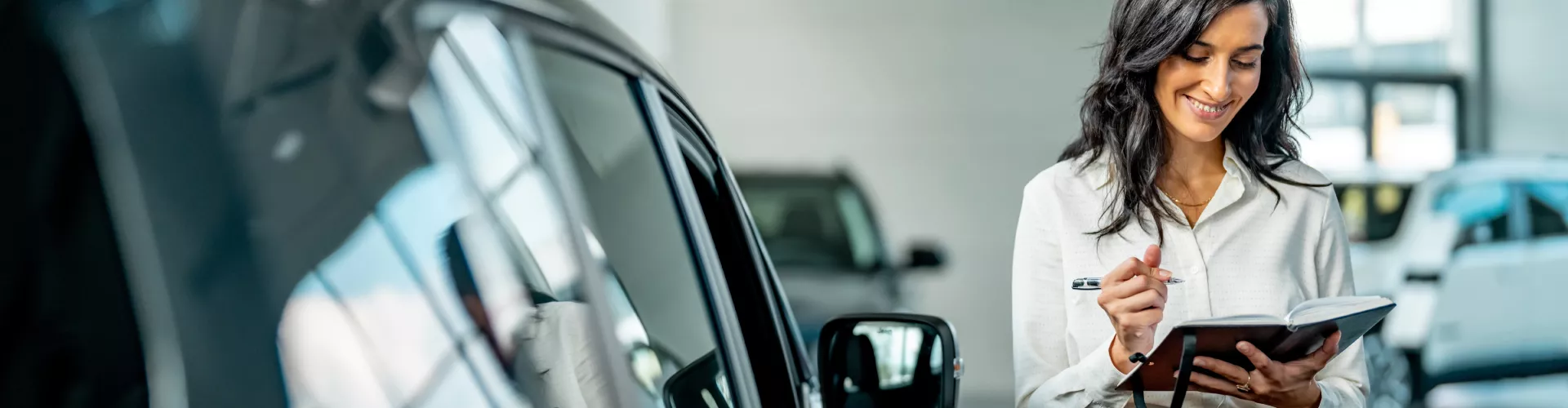 Woman at car dealer