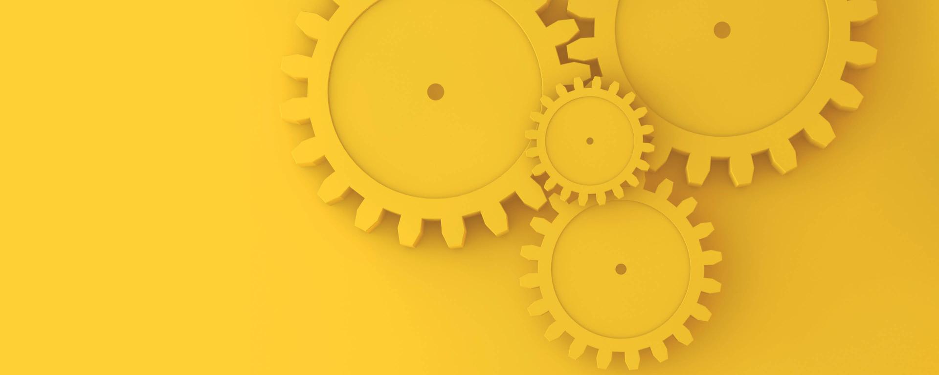 wheels in different sizes in a yellow color on a yellow background