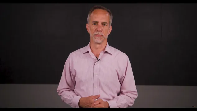 James Marcella in the middle with a black background.
