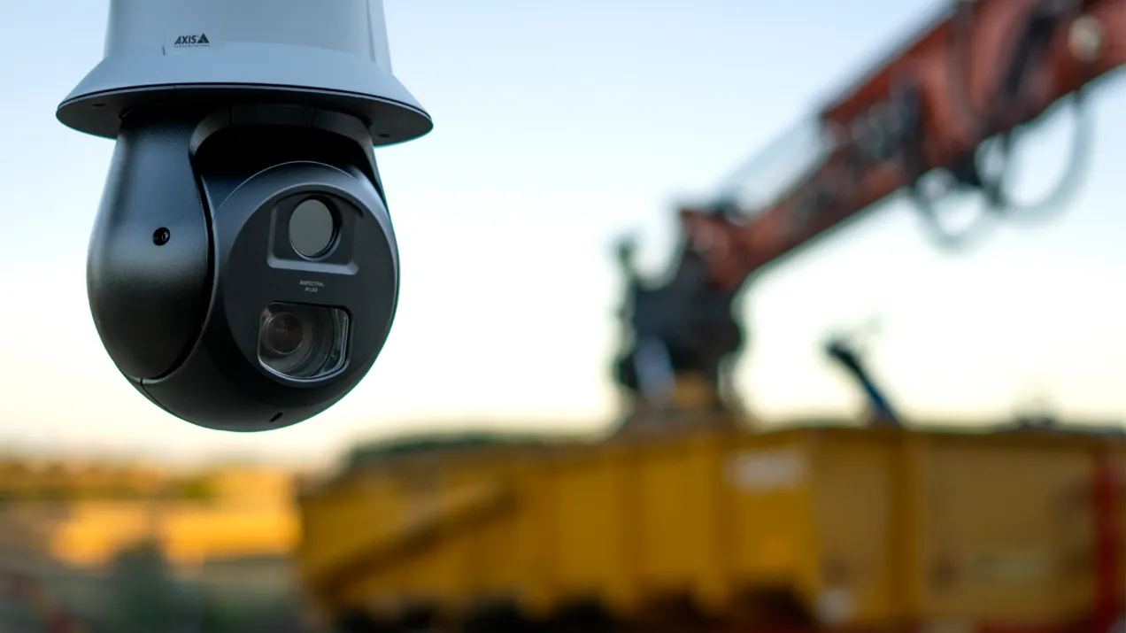 Close up of AXIS Q6411-LE used in a construction site during sunset.
