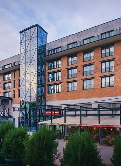 Merani office bulding viewed from outside, made of brick and glass.
