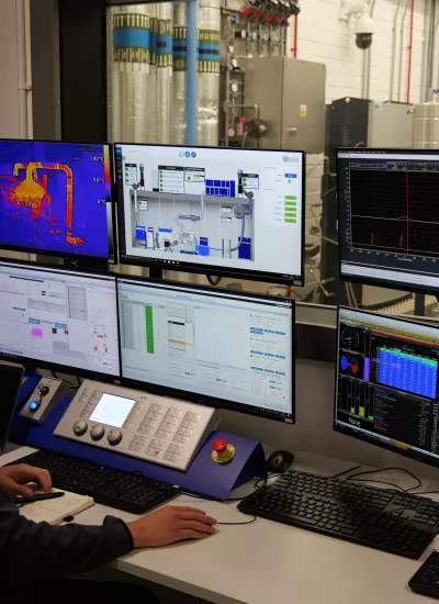 Man operating safety systems on computer