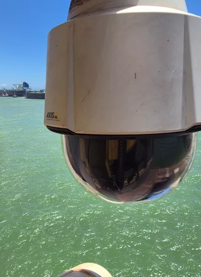 Camera in foreground with port in background