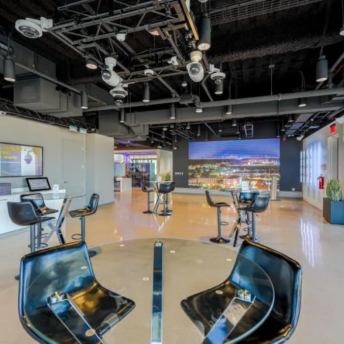 Mingle area with high tables with chairs in Minneapolis's AEC.