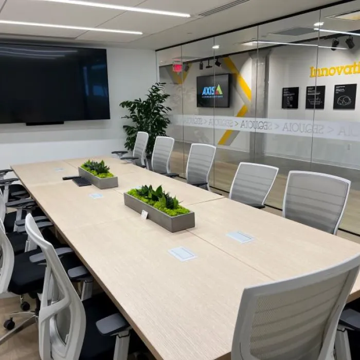 Meeting room with a long table and multiple chairs in the AEC of San Jose.