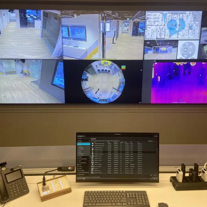 Surveillance monitors above a desk in the AEC of Vancouver.