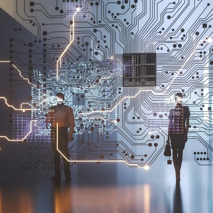 Two people in front of a digital circulate. 