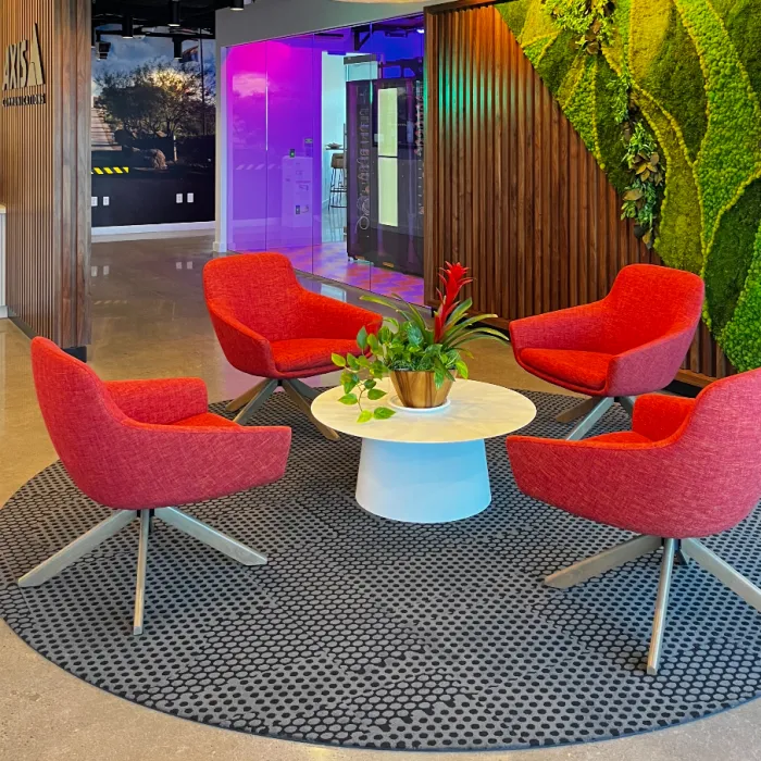 A table and four red chairs in Phoenix's AEC.