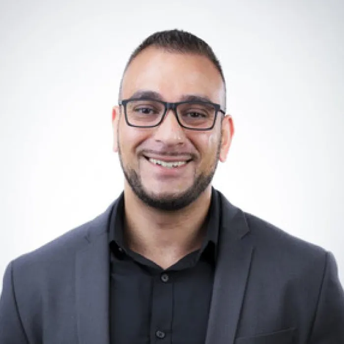 Headshot of Bijan Noghrehkar.