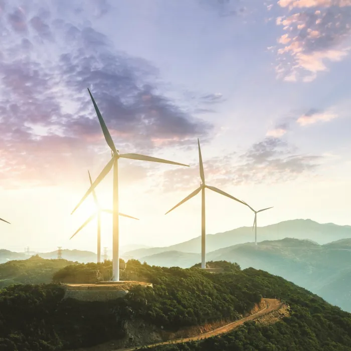 Wind turbines placed on mountain roads.
