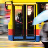Blurry picture of bus passing by on a street