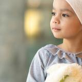 Close up of a young girl with teddy bear