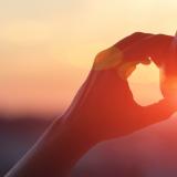 silhouette of a woman with headphone in front of a sunset