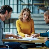 Woman and two men having a meeting