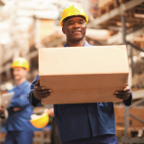 warehouse worker carrying a box